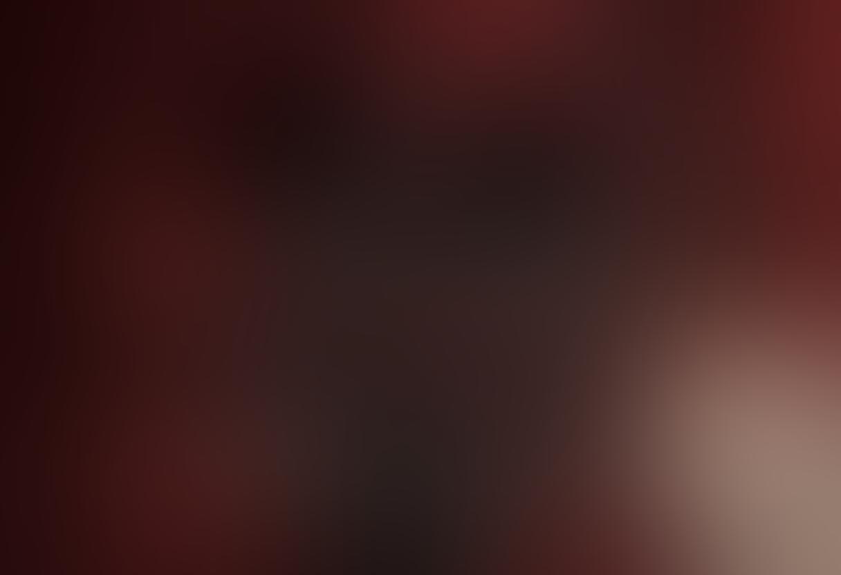 A beautifully arranged display of luxurious lingerie, featuring intricate lace patterns and rich fabrics in a sensual color palette of deep reds, blacks, and soft pastels. The setting includes delicate accessories such as satin ribbons and elegant jewelry to enhance the intimate atmosphere. A hint of soft lighting casts alluring shadows, creating a welcoming and romantic vibe. super-realistic. vibrant colors. soft focus.